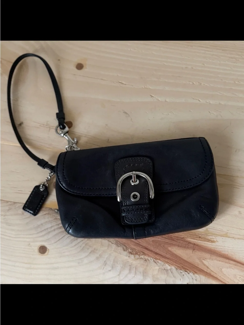 Coach, Soho, wristlet Black Leather Wristlet with Buckle Detail excellent condi